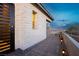 An exterior shot showcases a stone-clad home with a private walkway and well-placed lighting for enhanced curb appeal at 11700 Belorado Ave, Las Vegas, NV 89138
