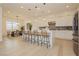An open floor plan kitchen area featuring a center island, stainless steel appliances, and modern decor at 11700 Belorado Ave, Las Vegas, NV 89138