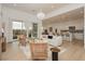 An open floor plan living room area flows into a kitchen and a view of an outdoor seating area at 11700 Belorado Ave, Las Vegas, NV 89138