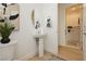 Modern powder room with pedestal sink and stylish decor at 11700 Belorado Ave, Las Vegas, NV 89138