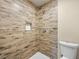 Bathroom shower with wood-look tile, mosaic tile niche, and rainfall shower head at 1405 Vegas Valley Dr # 226, Las Vegas, NV 89169