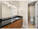 Bathroom with dark counter, dark wood cabinets, and a toilet in a separate space at 1405 Vegas Valley Dr # 226, Las Vegas, NV 89169