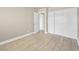 Bedroom features a large closet with sliding doors, light hardwood floors, and neutral paint at 1405 Vegas Valley Dr # 226, Las Vegas, NV 89169