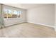 Bright bedroom features large window with views, wood-look flooring, and neutral walls at 1405 Vegas Valley Dr # 226, Las Vegas, NV 89169