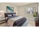Staged bedroom featuring a queen-sized bed, a plant in the corner and large window at 1405 Vegas Valley Dr # 226, Las Vegas, NV 89169