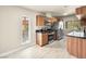 Updated kitchen boasts stainless steel appliances, wood cabinets, and black countertops at 1405 Vegas Valley Dr # 226, Las Vegas, NV 89169