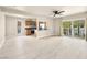 Bright and airy living room featuring wood-look floors, neutral walls, and a sliding glass door to a balcony at 1405 Vegas Valley Dr # 226, Las Vegas, NV 89169