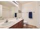 Bathroom featuring double sinks, vanity, mirror, and a shower-tub combination at 1684 Flores Ln, Henderson, NV 89012