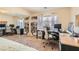 Sunlit bedroom featuring plush carpeting, a full-wall mirror closet, and office space at 1684 Flores Ln, Henderson, NV 89012
