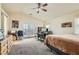 Bright bedroom with a vaulted ceiling, and access to a balcony and desk area at 1684 Flores Ln, Henderson, NV 89012