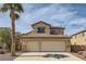 Charming home featuring a beige exterior with a three-car garage and beautiful palm tree at 1684 Flores Ln, Henderson, NV 89012