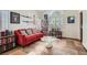 Cozy living room featuring a plush sofa, accent pillows, and curated bookshelves at 1684 Flores Ln, Henderson, NV 89012