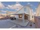 The backyard shows a covered patio, rock landscaping, and privacy fencing at 1813 Villa Vista Way, Las Vegas, NV 89128