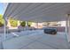 This backyard features a covered patio and low-maintenance landscaping at 1813 Villa Vista Way, Las Vegas, NV 89128