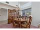 Charming dining room with wooden furniture, chandelier, and bright natural light at 1813 Villa Vista Way, Las Vegas, NV 89128