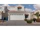 Charming two-story home with a well-maintained front yard and attached two-car garage at 1813 Villa Vista Way, Las Vegas, NV 89128