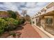 Backyard view featuring drought-resistant landscaping, gravel, and a covered patio at 2175 Point Mallard Dr, Henderson, NV 89012
