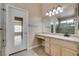Bathroom vanity has granite countertop, a large mirror, and views to the bedroom at 2175 Point Mallard Dr, Henderson, NV 89012