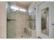 Bathroom has a large walk-in shower with glass door and a window for natural light at 2175 Point Mallard Dr, Henderson, NV 89012