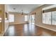 Open-concept dining room features wood floors and provides easy access to the kitchen and patio at 2175 Point Mallard Dr, Henderson, NV 89012