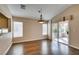 Bright dining room features wood floors, large windows and sliding glass door leading to the patio at 2175 Point Mallard Dr, Henderson, NV 89012