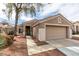 Charming single-story home with a two-car garage and low-maintenance desert landscaping at 2175 Point Mallard Dr, Henderson, NV 89012