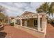 Exterior of house with a covered patio, desert landscaping, and neutral paint at 2175 Point Mallard Dr, Henderson, NV 89012