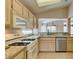 Open concept kitchen has stainless steel dishwasher and granite countertops at 2175 Point Mallard Dr, Henderson, NV 89012
