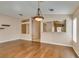 Open floorplan with wood floors showcasing the living room connecting to other living spaces at 2175 Point Mallard Dr, Henderson, NV 89012