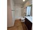 This bathroom features a shower-tub combo and coordinating vanity at 2232 Aspen Mirror Way # 204, Laughlin, NV 89029
