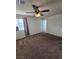 Standard bedroom featuring ceiling fan, window, and carpet flooring at 2232 Aspen Mirror Way # 204, Laughlin, NV 89029