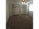 Bedroom featuring plush carpeting, neutral walls and spacious closet space at 2232 Aspen Mirror Way # 204, Laughlin, NV 89029