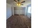 The bedroom offers carpeting, a ceiling fan, and double wide, opened closets at 2232 Aspen Mirror Way # 204, Laughlin, NV 89029