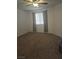 Neutral bedroom featuring a ceiling fan, plush carpeting, and window with light-filtering blinds at 2232 Aspen Mirror Way # 204, Laughlin, NV 89029