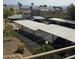 View of the community carport with covered parking spaces and desert landscaping at 2232 Aspen Mirror Way # 204, Laughlin, NV 89029