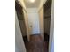 Walk-in closet featuring carpet flooring and built-in shelving for optimal organization and storage at 2232 Aspen Mirror Way # 204, Laughlin, NV 89029