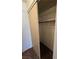 Walk-in closet with sliding door, featuring carpet flooring and built-in shelving at 2232 Aspen Mirror Way # 204, Laughlin, NV 89029