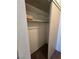 Walk-in closet featuring carpet flooring and built-in shelving and closet rod for organizing at 2232 Aspen Mirror Way # 204, Laughlin, NV 89029