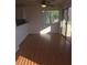 Bright dining area boasts laminate floors, a sliding glass door, and serene natural light at 2232 Aspen Mirror Way # 204, Laughlin, NV 89029