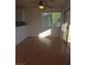 Sunlit dining area with laminate wood floors, sliding door, and a view of greenery outside at 2232 Aspen Mirror Way # 204, Laughlin, NV 89029