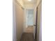 Hallway leads to bathroom featuring wood floors and tile surround shower/tub at 2232 Aspen Mirror Way # 204, Laughlin, NV 89029