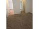 Hallway connecting to bedroom with closet, adjacent bathroom, and laminate flooring at 2232 Aspen Mirror Way # 204, Laughlin, NV 89029