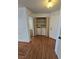 Hallway featuring a laundry closet and wood-look flooring, illuminated by a ceiling light fixture at 2232 Aspen Mirror Way # 204, Laughlin, NV 89029
