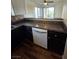 This kitchen boasts modern appliances, dark cabinets, and sleek countertops at 2232 Aspen Mirror Way # 204, Laughlin, NV 89029