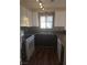 Kitchen with new appliances, dark cabinets, and mosaic backsplash at 2232 Aspen Mirror Way # 204, Laughlin, NV 89029