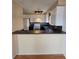 Kitchen featuring ample cabinetry, a peninsula counter with bar seating, and modern appliances at 2232 Aspen Mirror Way # 204, Laughlin, NV 89029