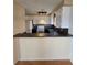 Kitchen featuring ample cabinetry, a peninsula counter with bar seating, and modern appliances at 2232 Aspen Mirror Way # 204, Laughlin, NV 89029