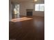 Spacious living room with fireplace, ceiling fan, hardwood floor and natural lighting at 2232 Aspen Mirror Way # 204, Laughlin, NV 89029