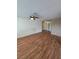 Empty living room with wood-look floors, ceiling fan, and neutral walls awaiting personal touches at 2232 Aspen Mirror Way # 204, Laughlin, NV 89029