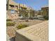 Community pool area with lush landscaping and seating at 2232 Aspen Mirror Way # 204, Laughlin, NV 89029